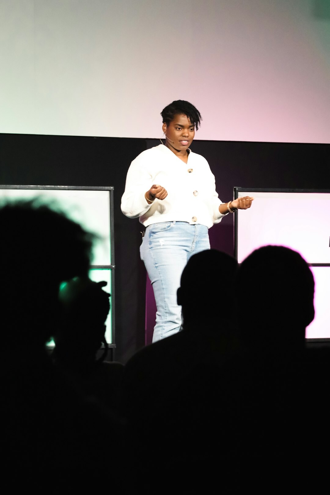 speaker on stage presenting